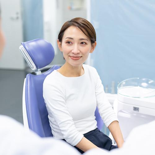 a person speaking with their cosmetic dentist 