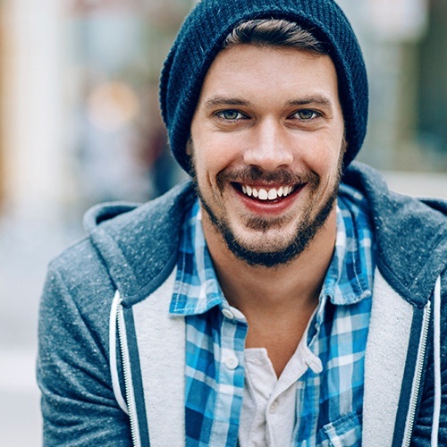 Man sharing flawless smile after cosmetic dental bonding