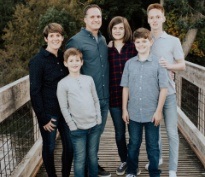 Doctor Cammack and his family on a bridge