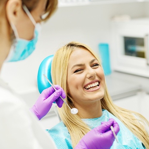 Woman laughing during dental checkup