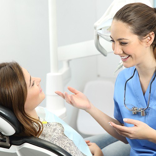 Dental team member providing patient education about oral hygiene