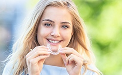 Woman about to put in aligner for ClearCorrect in Lacey, WA