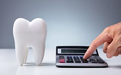 Tooth and calculator for figuring out dental costs