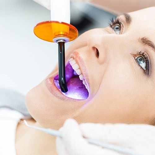 Patient receiving cosmetic dental bonding treatment