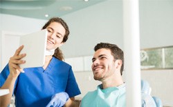 patient talking to dental assistant