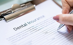 Close-up of a dental insurance form being filled out