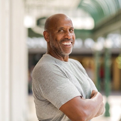 Smiling confident man with dental bridges in Lacey