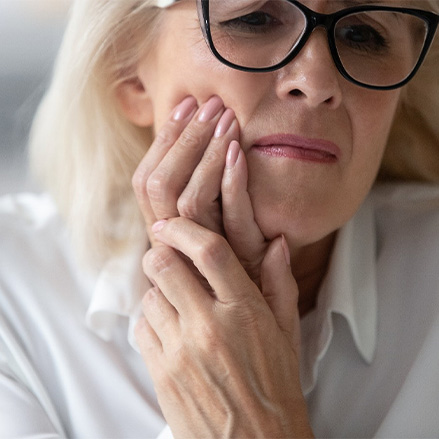 Older woman with a failed dental implant in Lacey