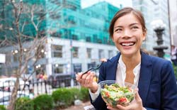 Woman eating salad in Lacey