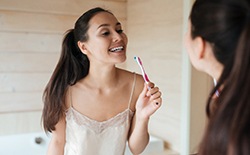 Woman holding a toothbrush