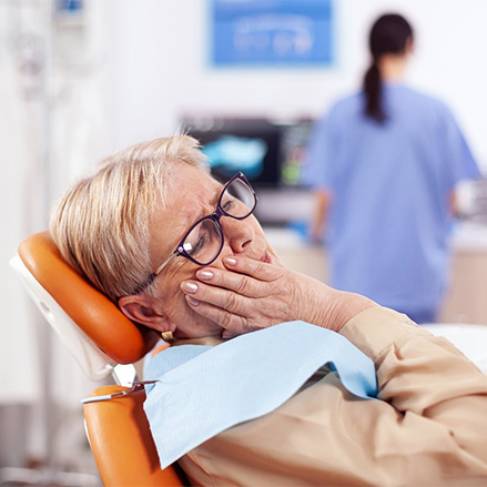 Woman with a failed dental implant in Lacey