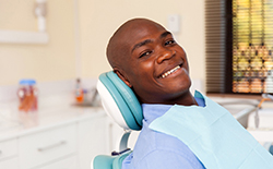 patient smiling who makes a good candidate for dental implants in Lacey