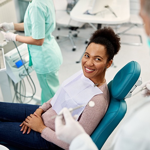 Dentist discussing smile makeovers with a female patient