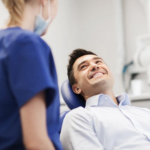 male patient smiling in dental chair
