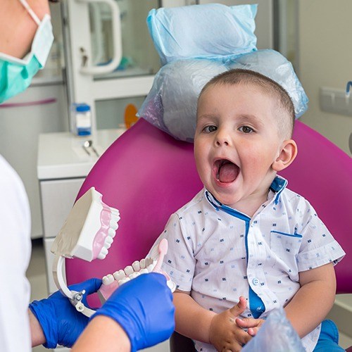 Young child smiling during children's dentistry visit