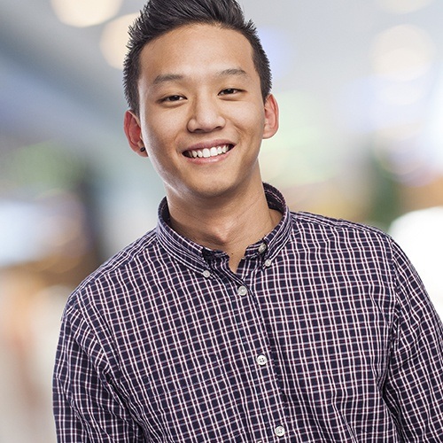 Teen boy smiling after children's dentistry visit