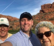 Doctor Peterson and two family members on a hike