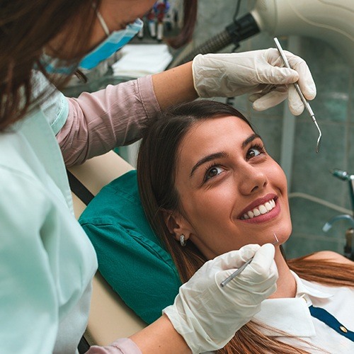 Woman smiling during preventive dentistry checkup and teeth cleaning