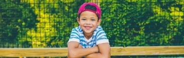 Young child smiling after children's dentistry visit