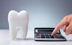 Dentist calculating the cost of SureSmile® in Lacy