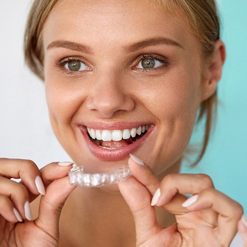 Woman using a whitening tray