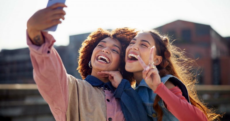 two female friends smiling for photo