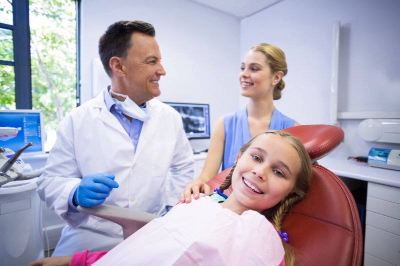 a mother and daughter visiting the family dentist 