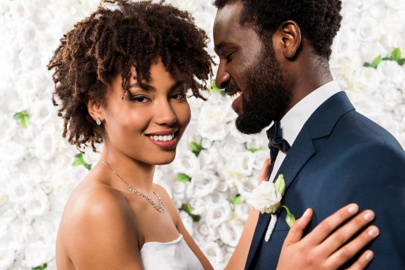 Young wedding couple smiling together