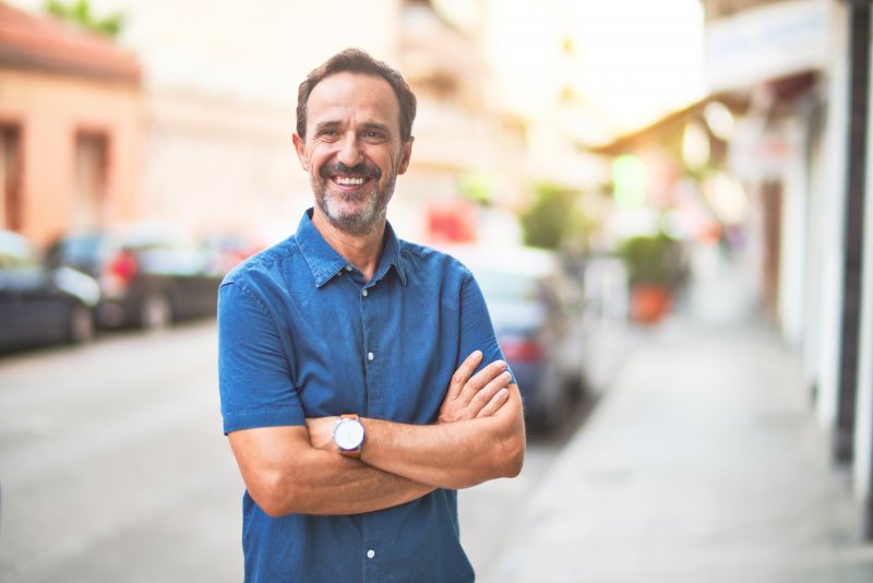 Man smiling with dental implants