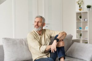 person resting at home after dental implant surgery