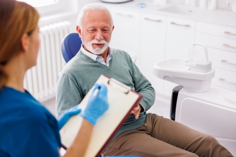 older gentleman inquiring about dental implants