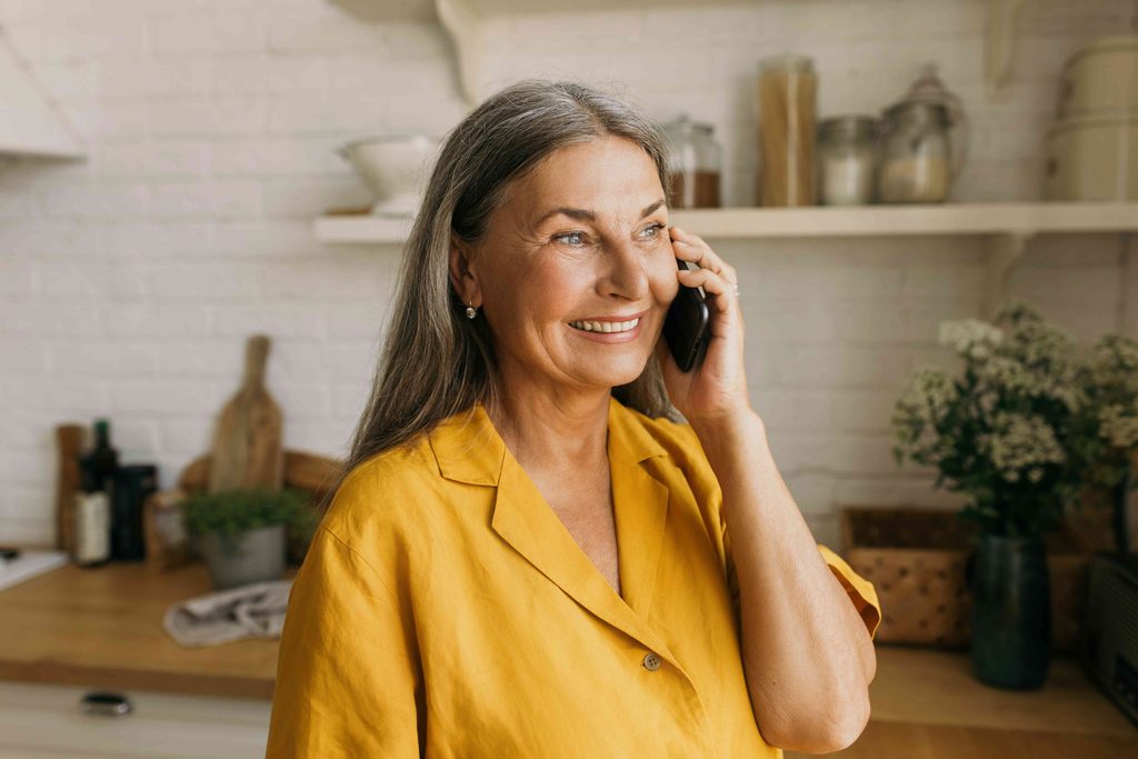 Woman smiling and talking on the phone